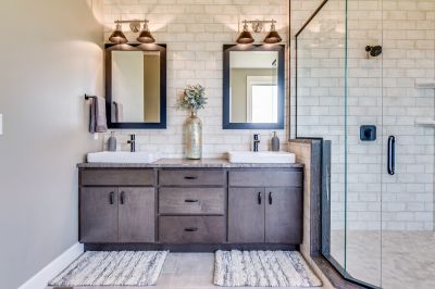 Vanity Area with Double Sinks and Mirror Lighting